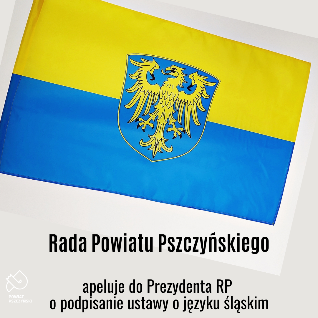 Flaga śląska - żółto-niebieska z orłem oraz napis Rada Powiatu Pszczyńskiego apeluje do prezydenta RP o podpisanie ustawy o języku śląskim